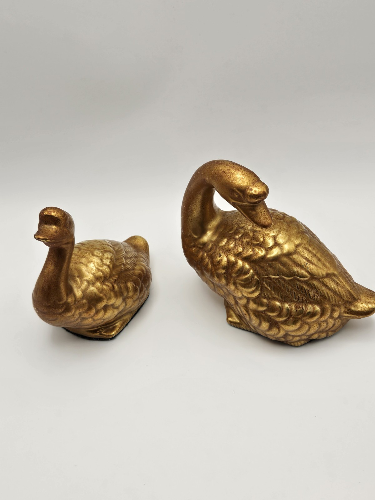 Pair of Unbranded Vintage Matte Gold Painted Ceramic Ducks Green Felt Bottom