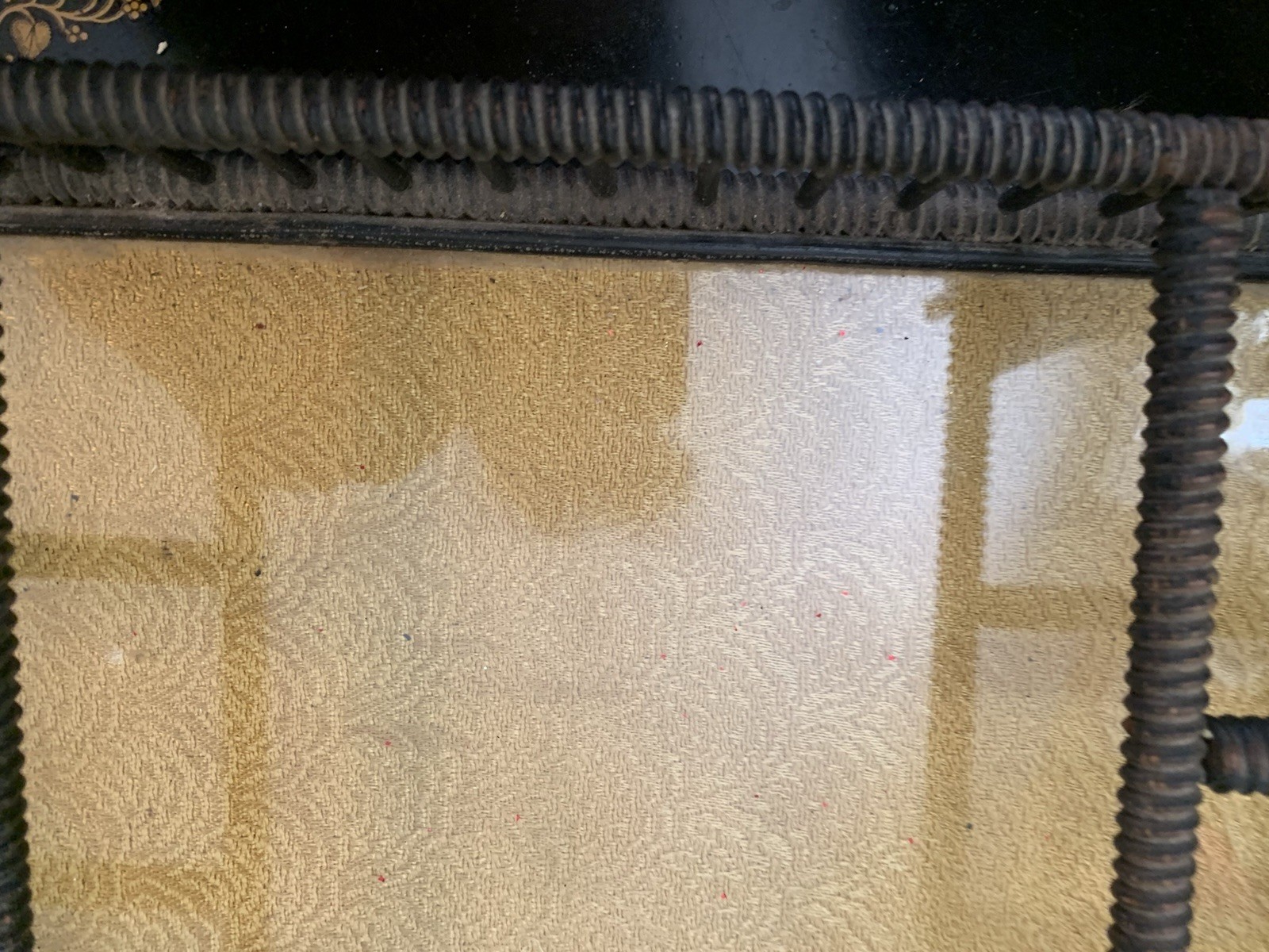 antique glass topped bottom covering gold fabric