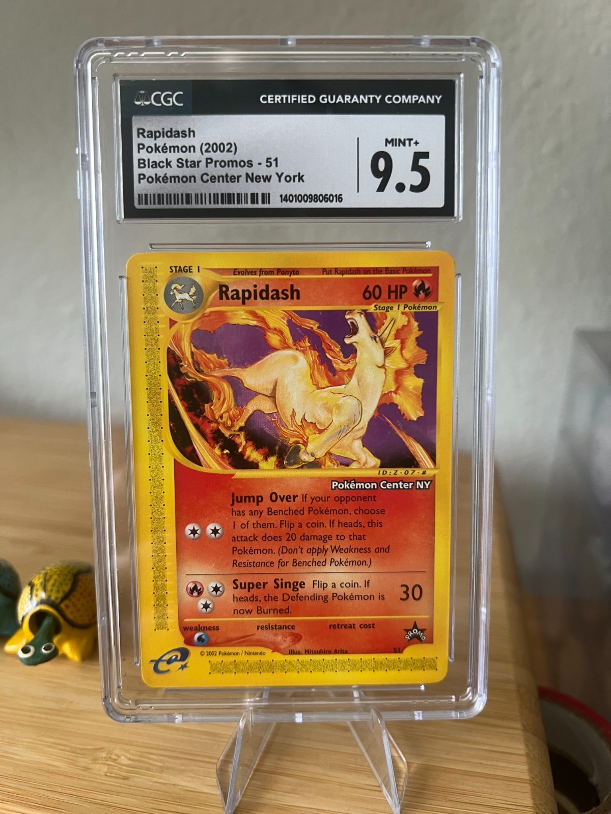 Rapidash (2002) Black Star Promos 51 – Pokémon Center NY (CGC 9.5)