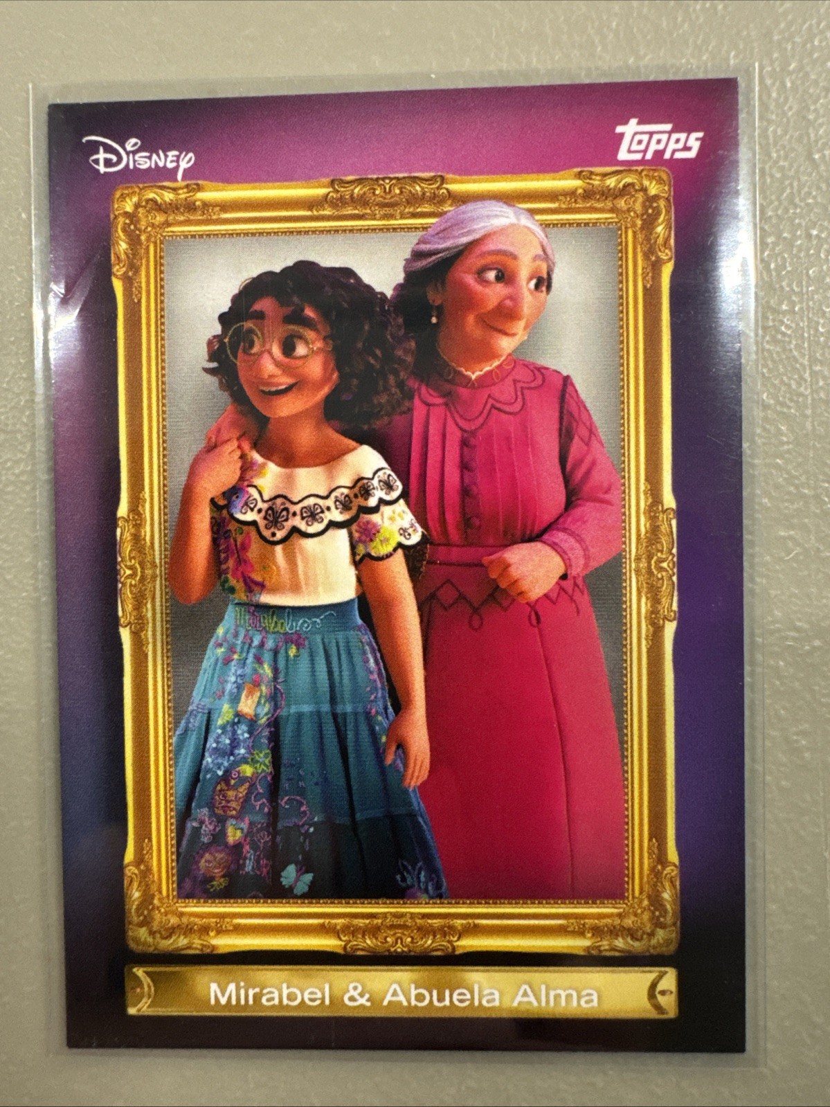 2026 Topps Disney Neon #FF-1 – Mirabel & Abuela Alma – Family First Insert